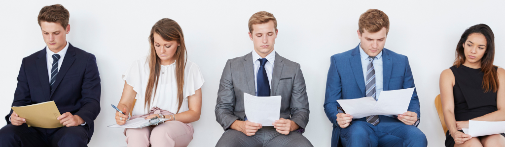 Five candidates sat on chairs waiting to interview