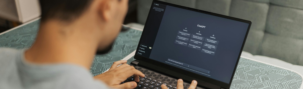 Man using ChatGPT on a laptop